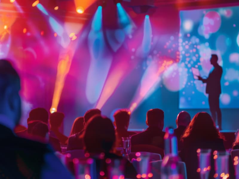 A group of people in a room with lights