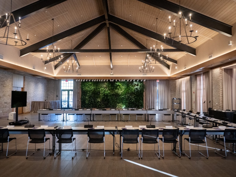 A room with a long table and chairs