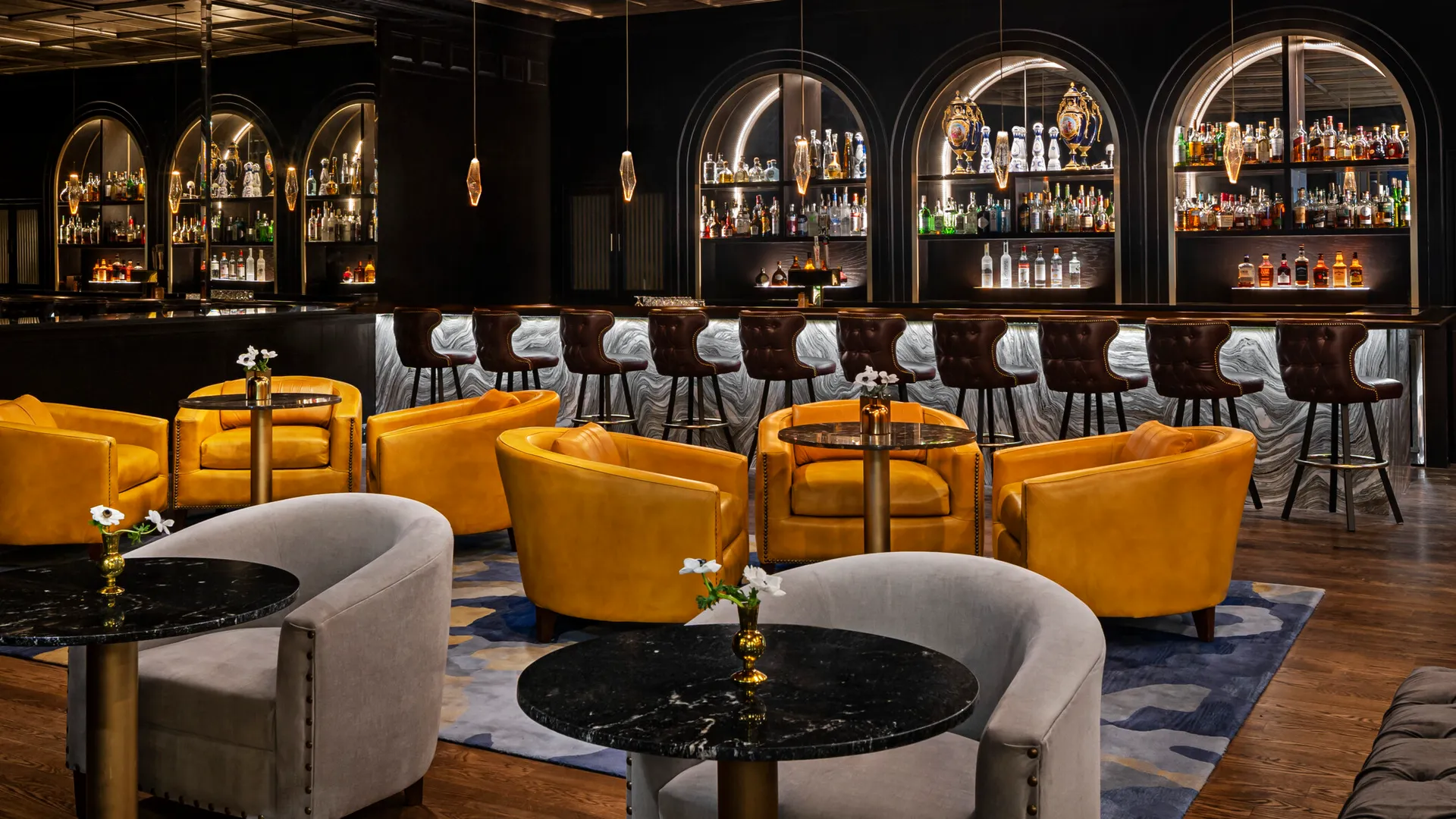 The bar at the hotel is decorated with yellow chairs