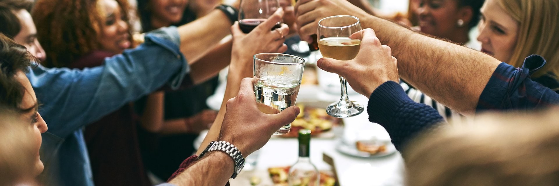 A group of people toasting at a party