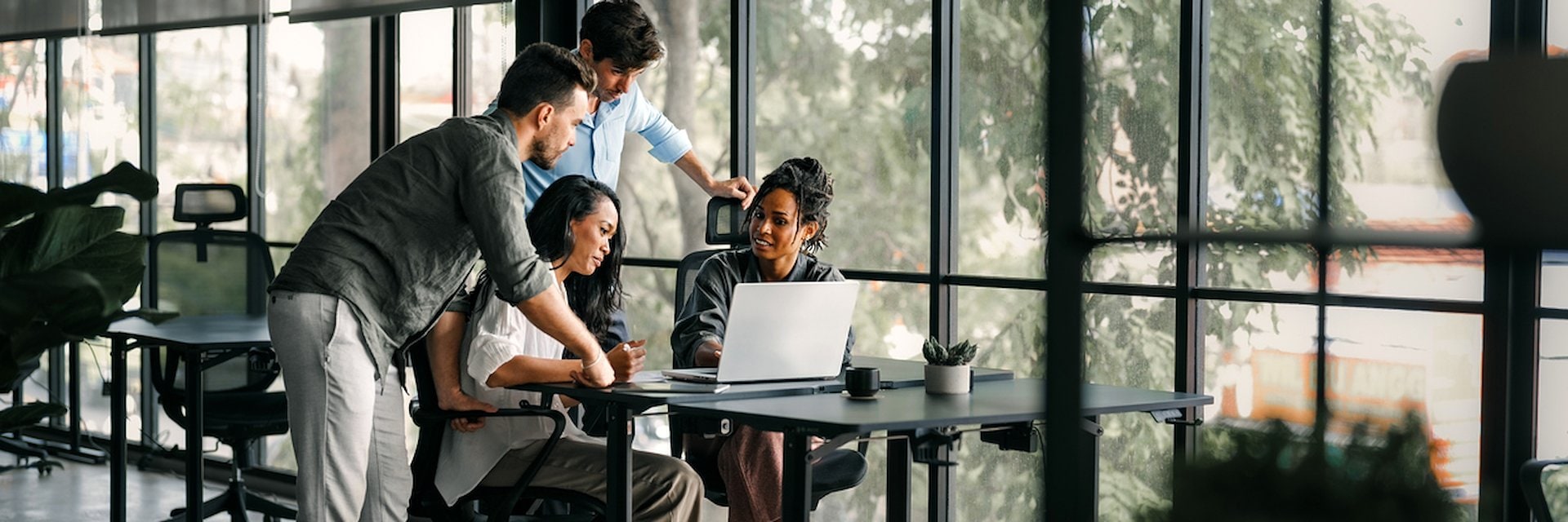 People working on a laptop in an office