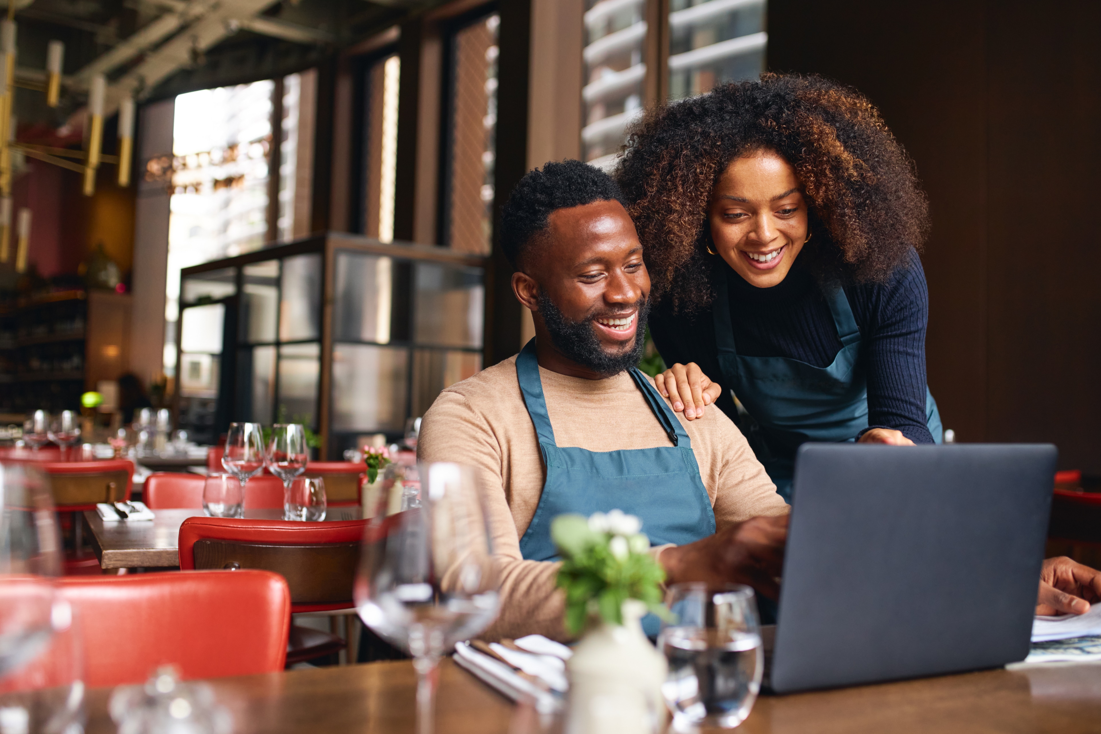 Business owners using FCU Anywhere online banking digital tool