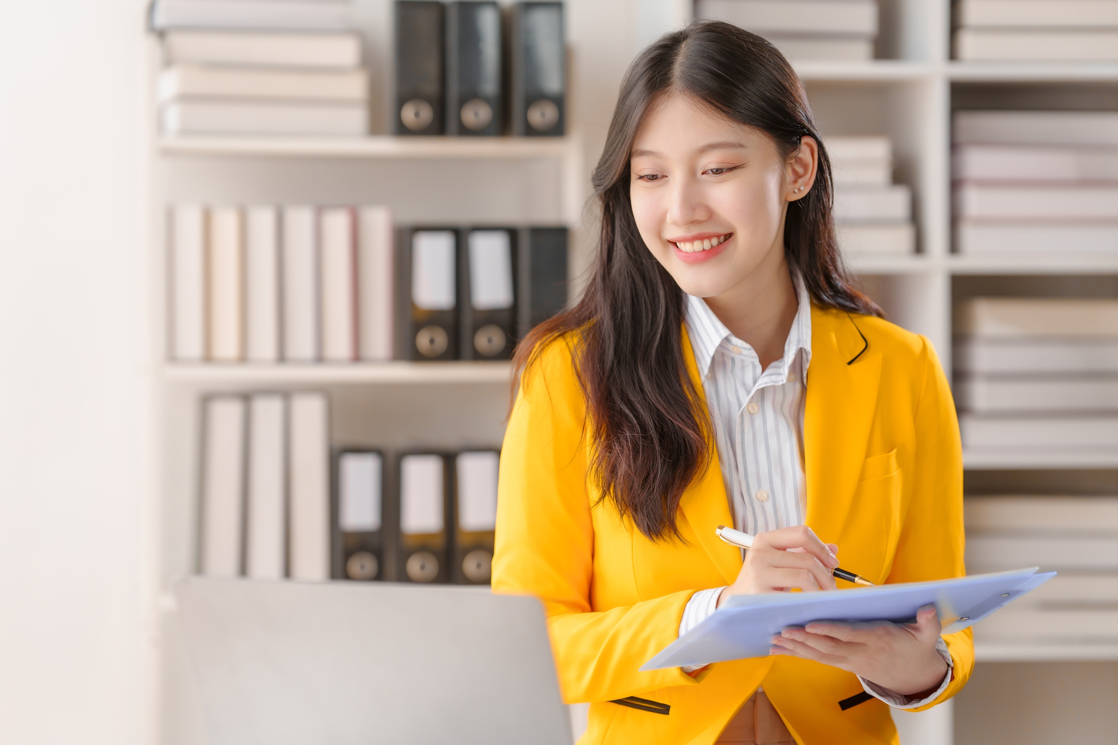 women filling out a personal loan application