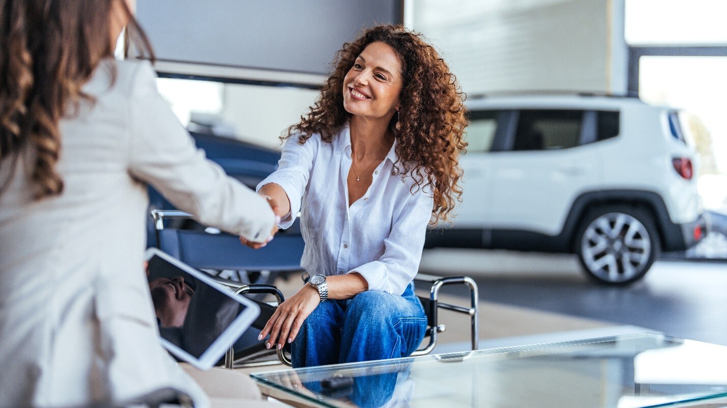 Happy business women securing vehicle financing