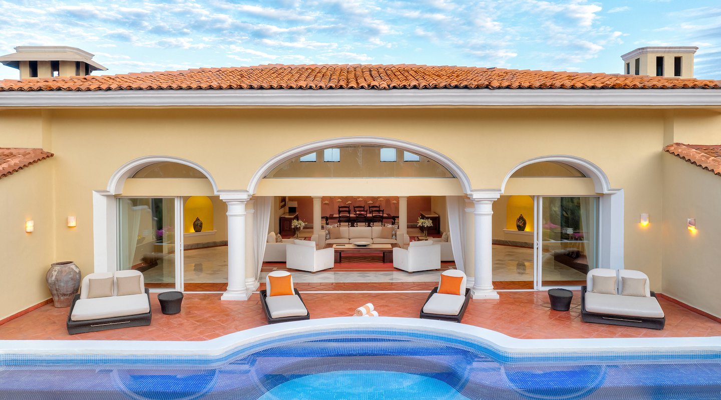 A large pool with a lounge chair and table, Casa Velas, Puerto Vallarta, Mexico