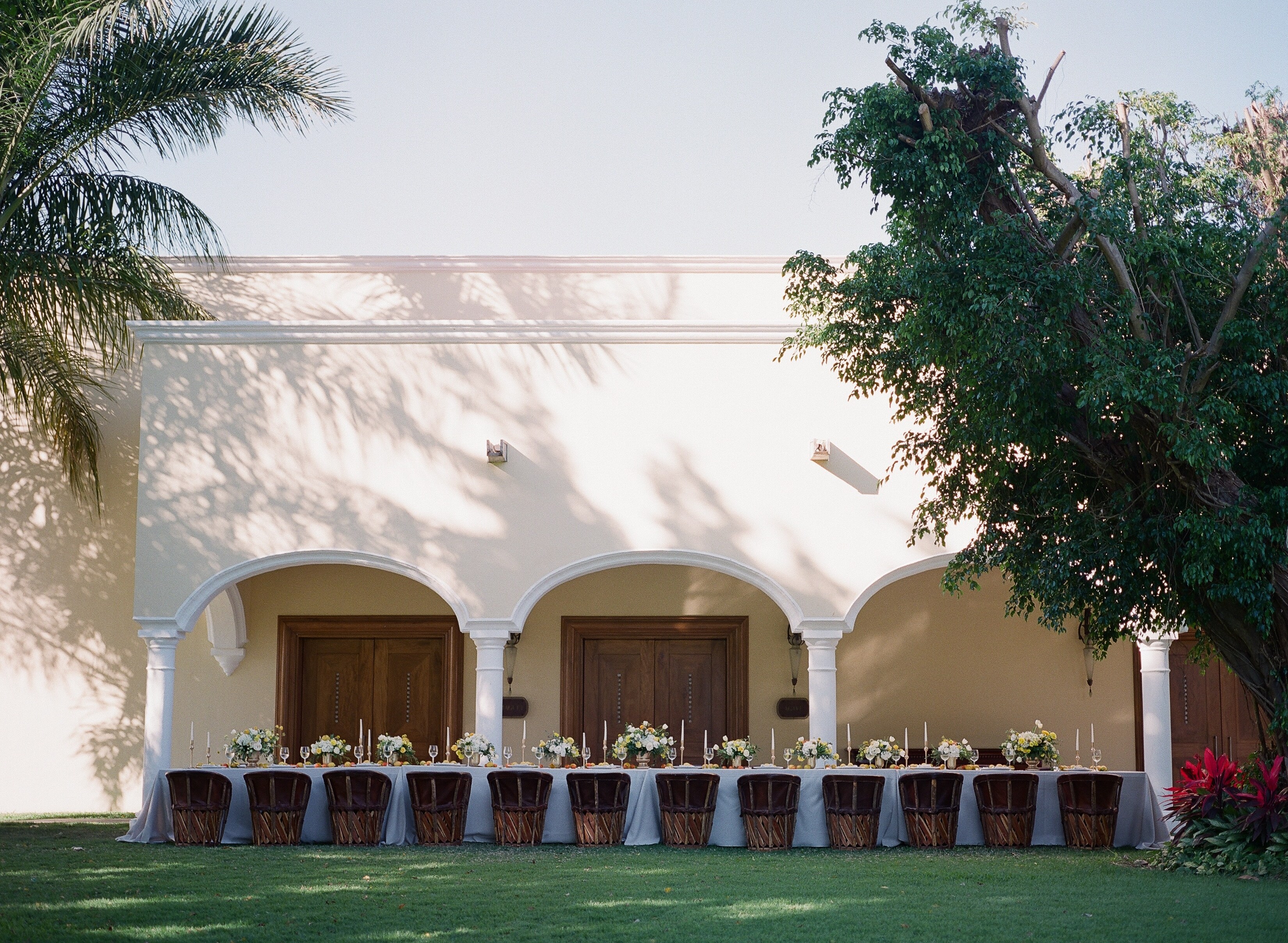 A wedding reception in a courtyard with chairs and tables, Casa Velas, Puerto Vallarta, Mexico