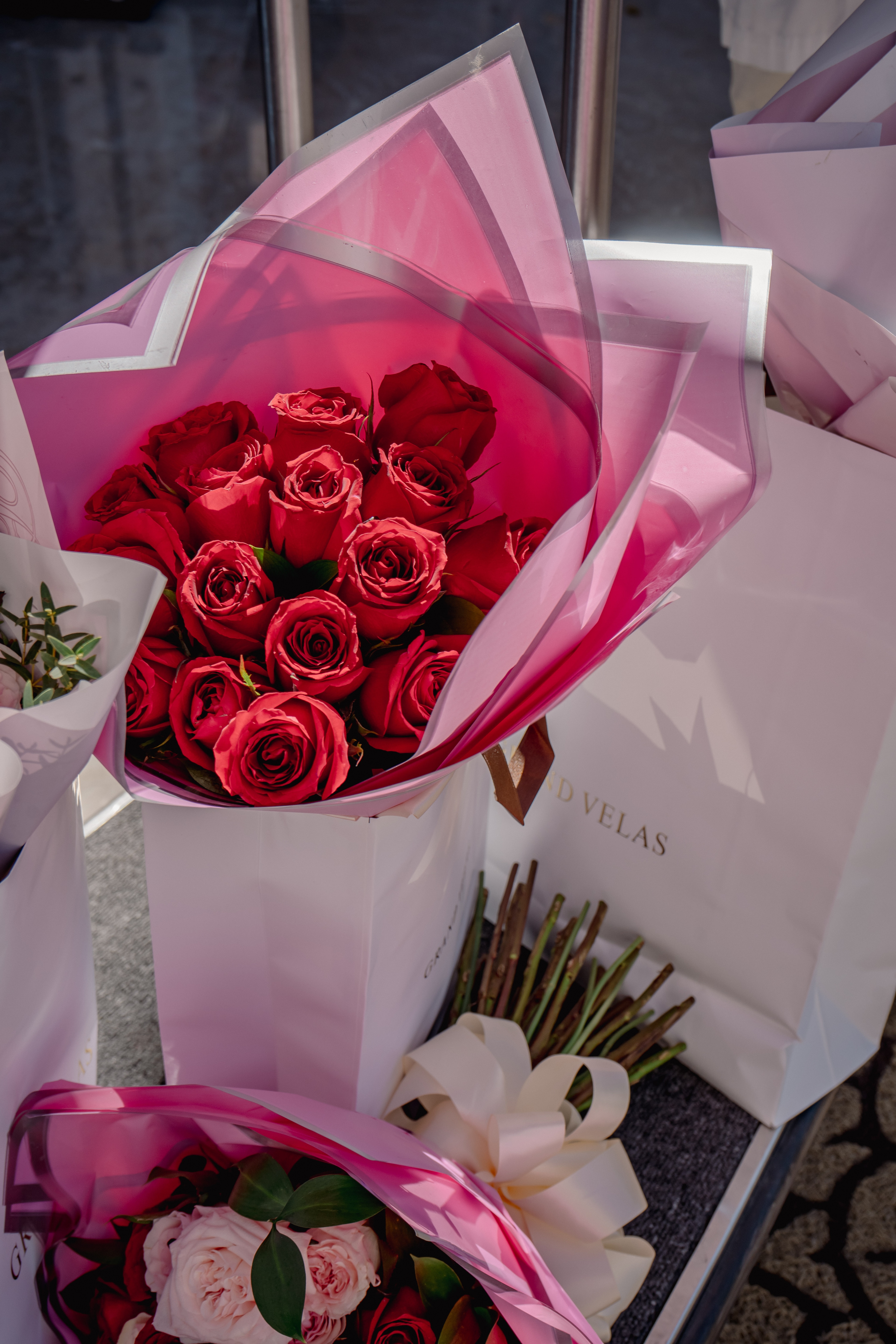 A bouquet of roses in a white box