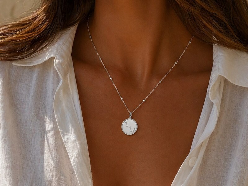 A woman wearing a necklace