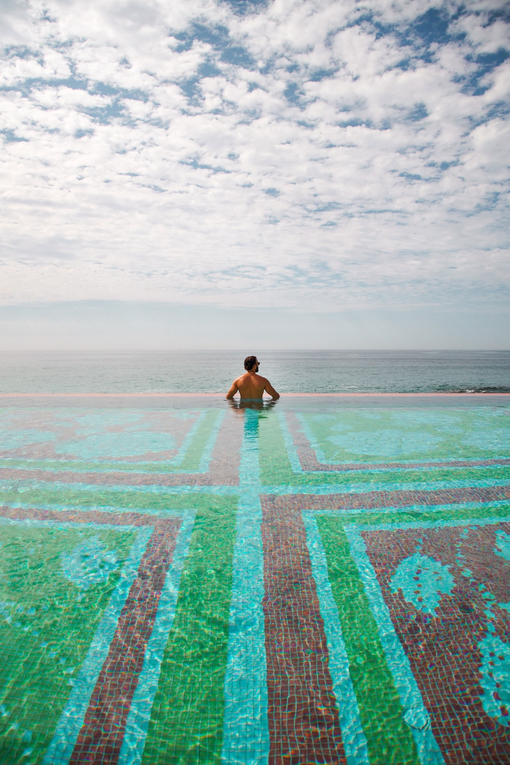 A man sitting in a pool
