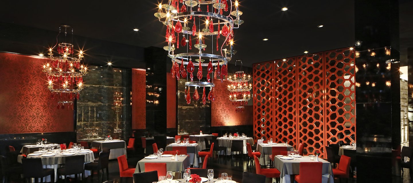 A restaurant with red and black decor and chandelier, Grand Velas Riviera Maya, Playa del Carmen, Mexico