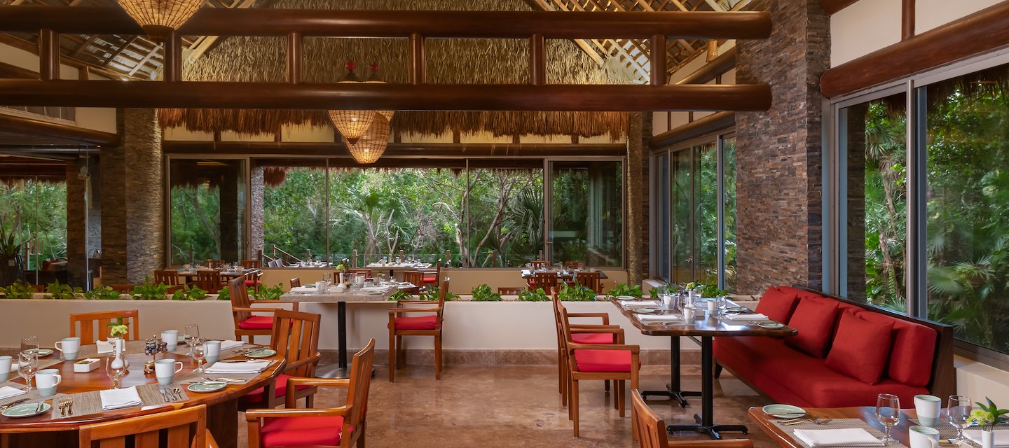 A restaurant with red chairs and tables, Grand Velas Riviera Maya, Playa del Carmen, Mexico