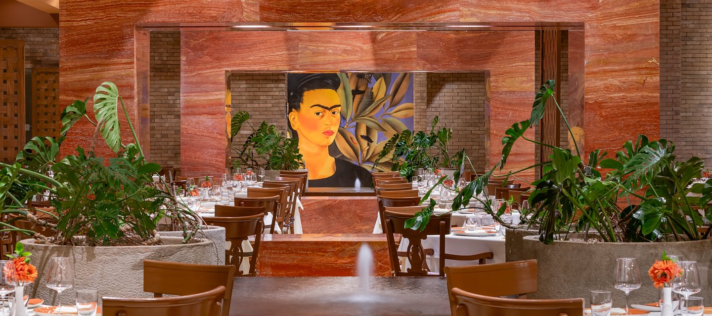A restaurant with a large painting of frida kahlo, Grand Velas Riviera Maya, Playa del Carmen, Mexico