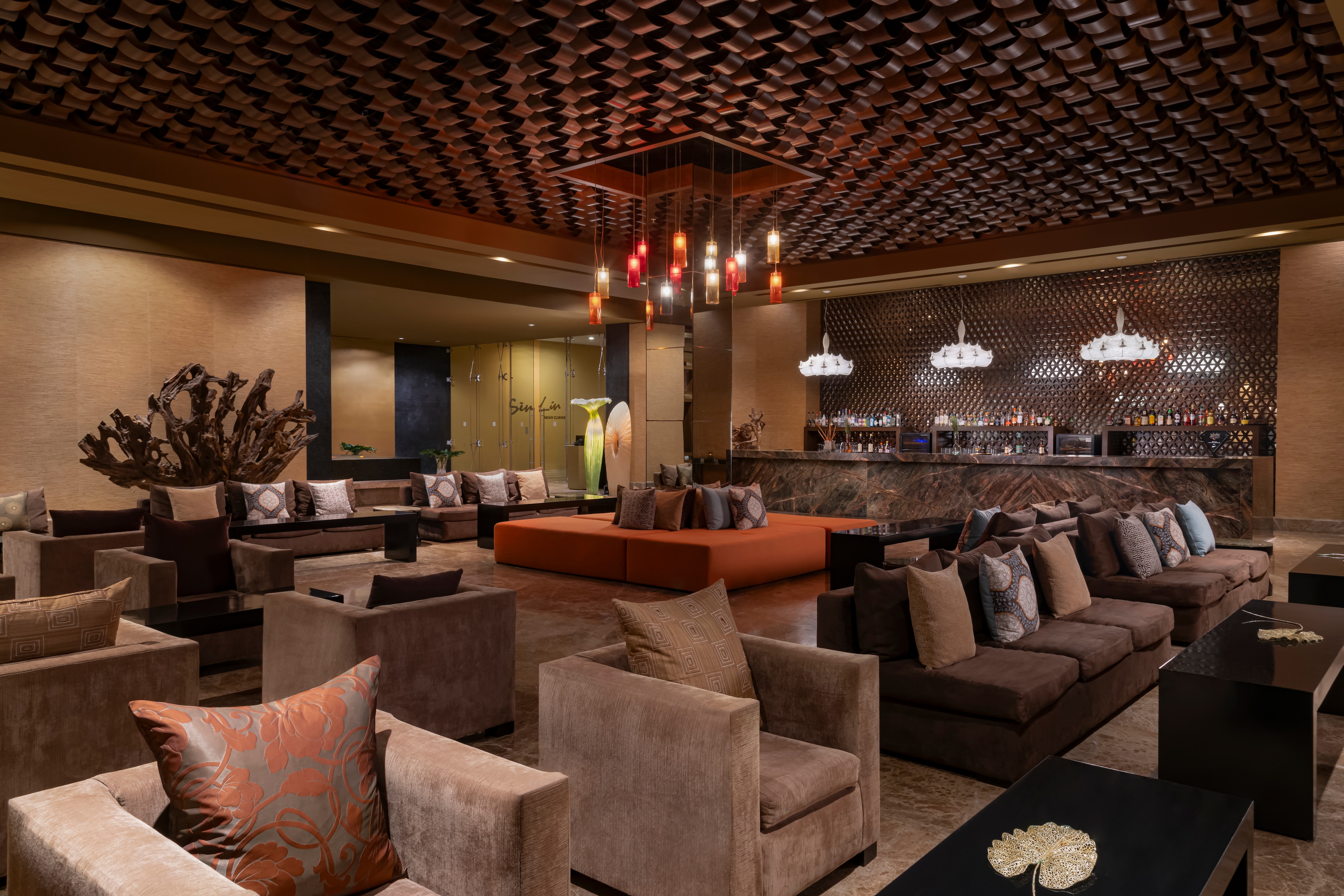 The lobby of a hotel with a bar and seating, Grand Velas Riviera Maya, Playa del Carmen, Mexico