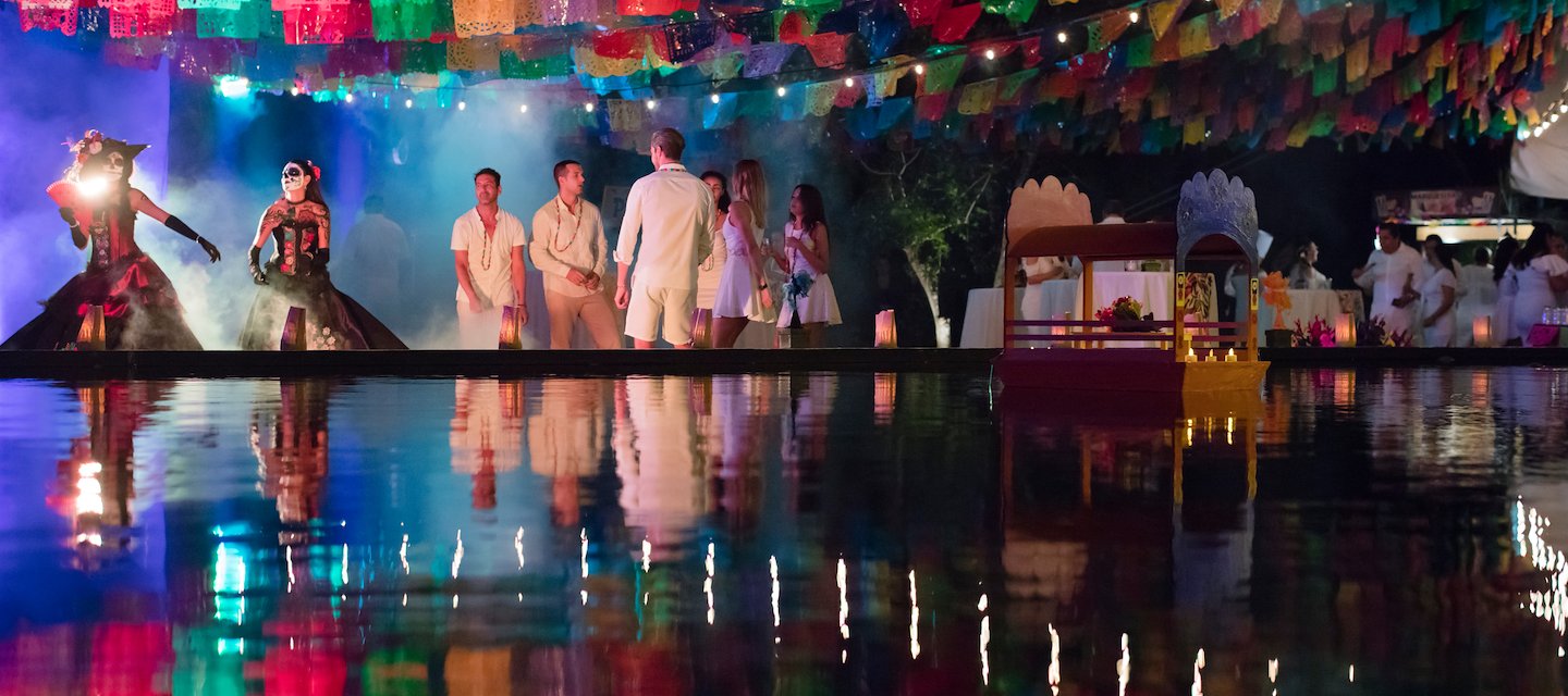 A group of people in white dresses are standing on a lake, Grand Velas Riviera Maya, Playa del Carmen, Mexico