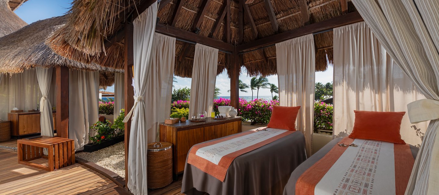 A spa room with two beds and a thatched roof, Grand Velas Riviera Maya, Playa del Carmen, Mexico