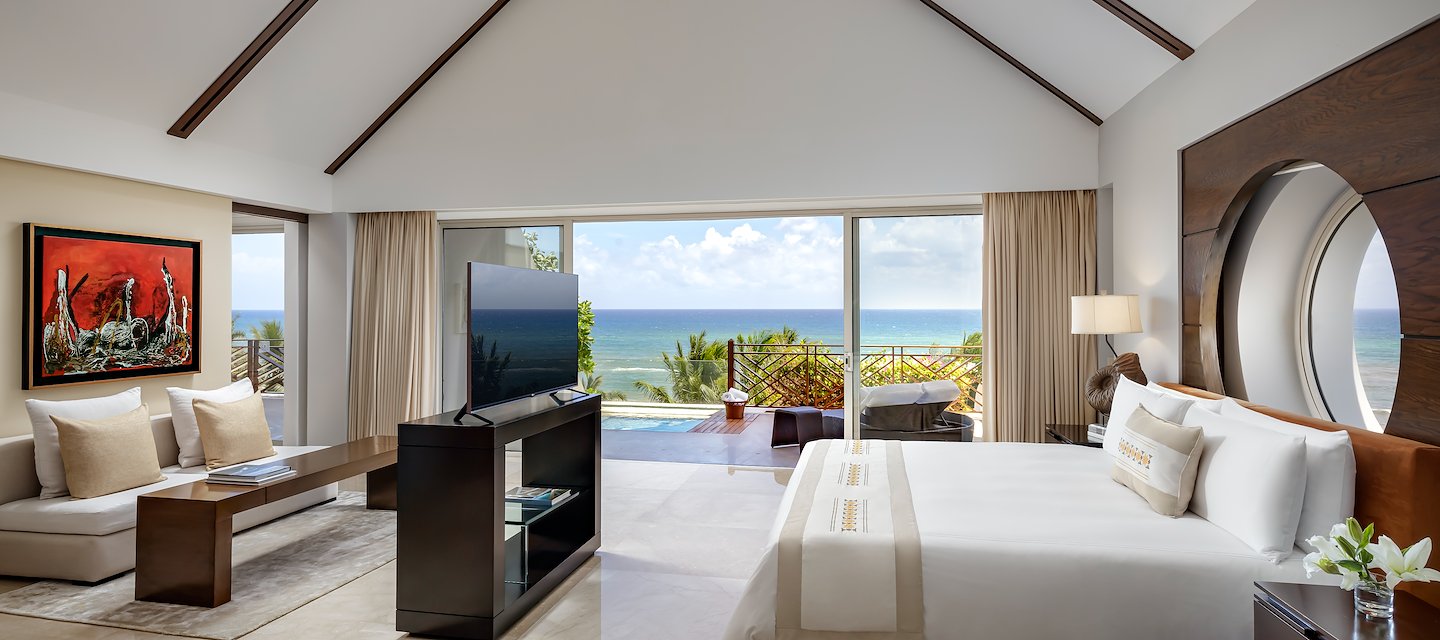 A large bedroom with a large bed and a view of the ocean, Grand Velas Riviera Maya, Playa del Carmen, Mexico