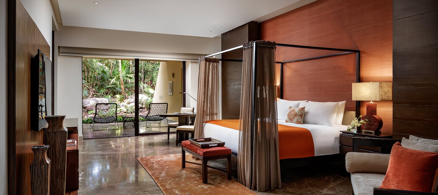 A large bedroom with a four poster bed and a balcony, Grand Velas Riviera Maya, Playa del Carmen, Mexico