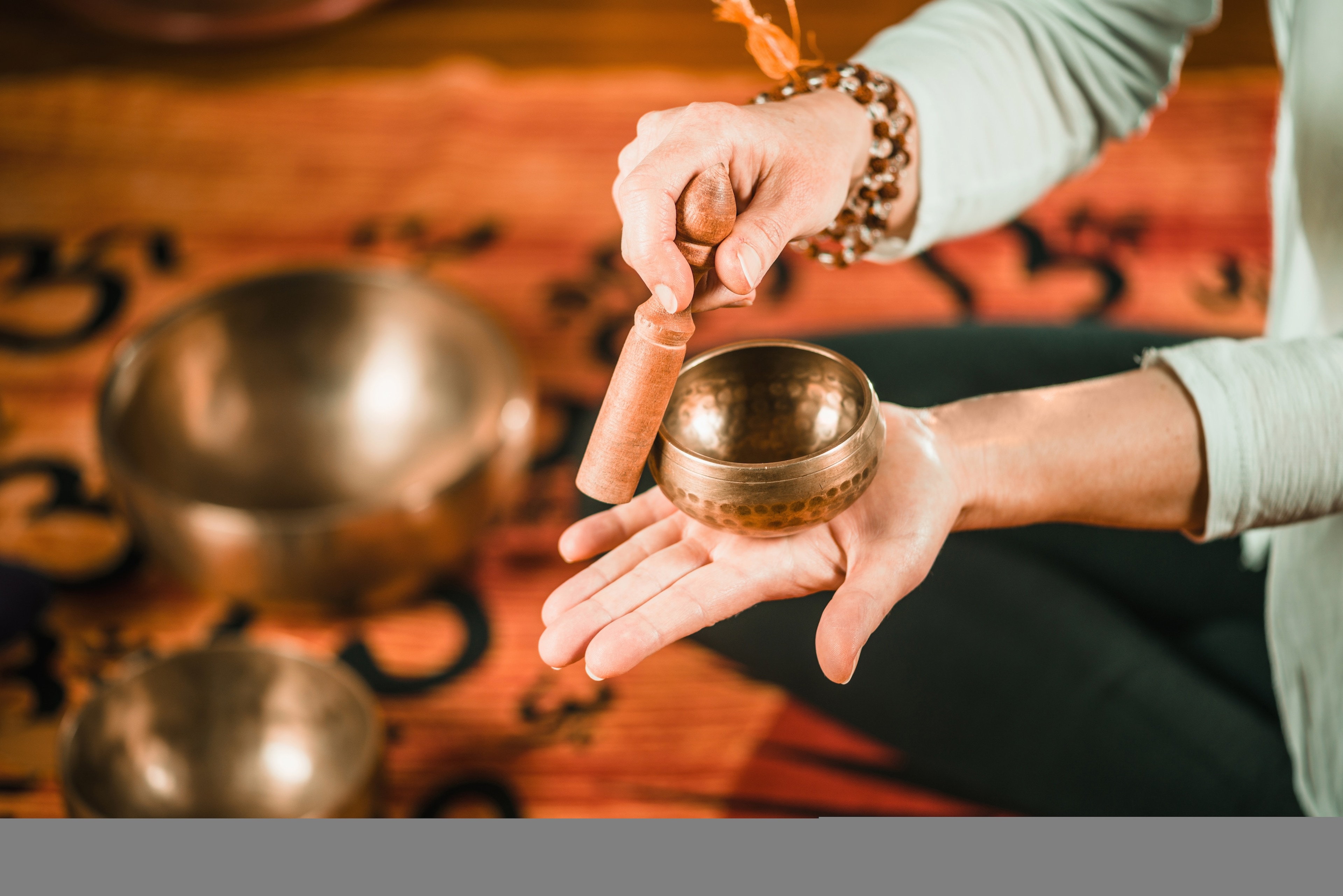 A person holding a small bowl