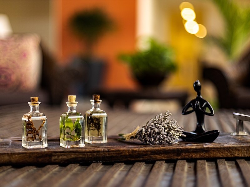 view of essentials oils on a wooden table