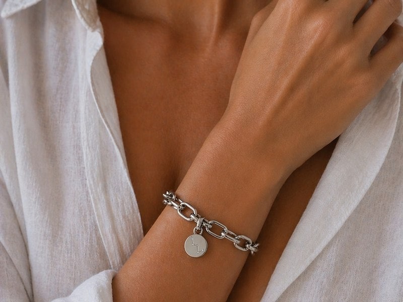A woman wearing a silver bracelet
