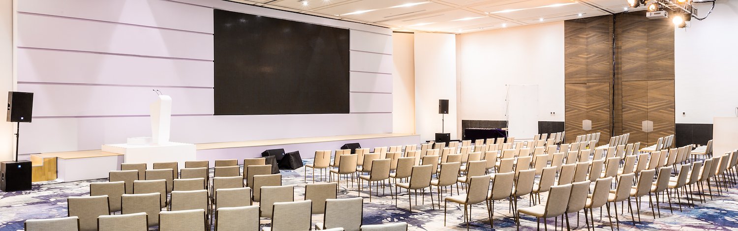 A large conference room with chairs and a projector screen, Grand Velas Los Cabos, San Lucas, Mexico