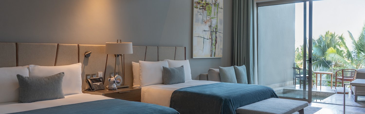 A hotel room with two beds and a balcony, Grand Velas Los Cabos, San Lucas, Mexico