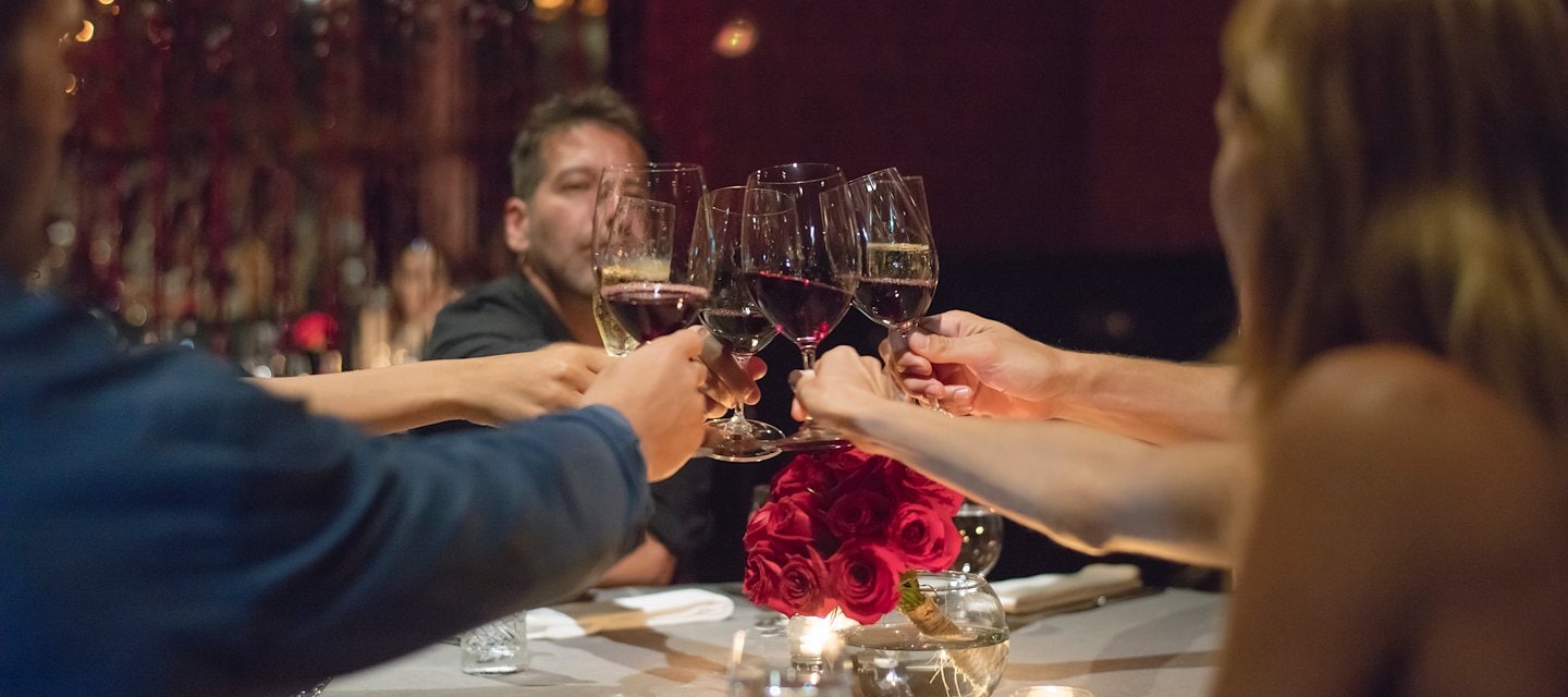 A group of people toasting with wine glasses, Grand Velas Riviera Maya, Playa del Carmen, Mexico