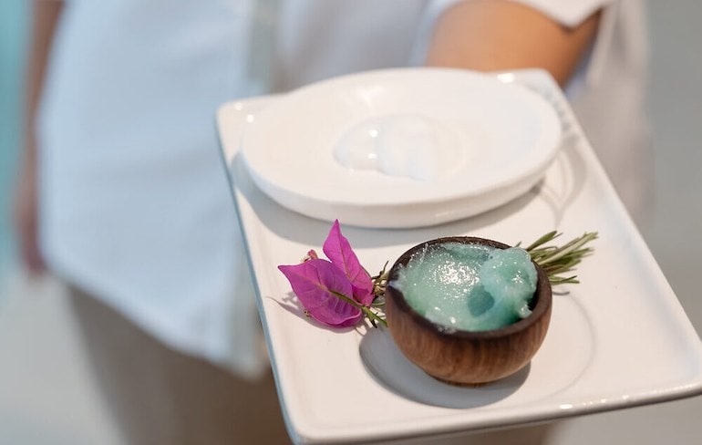 A plate with a bowl of blue gel on it
