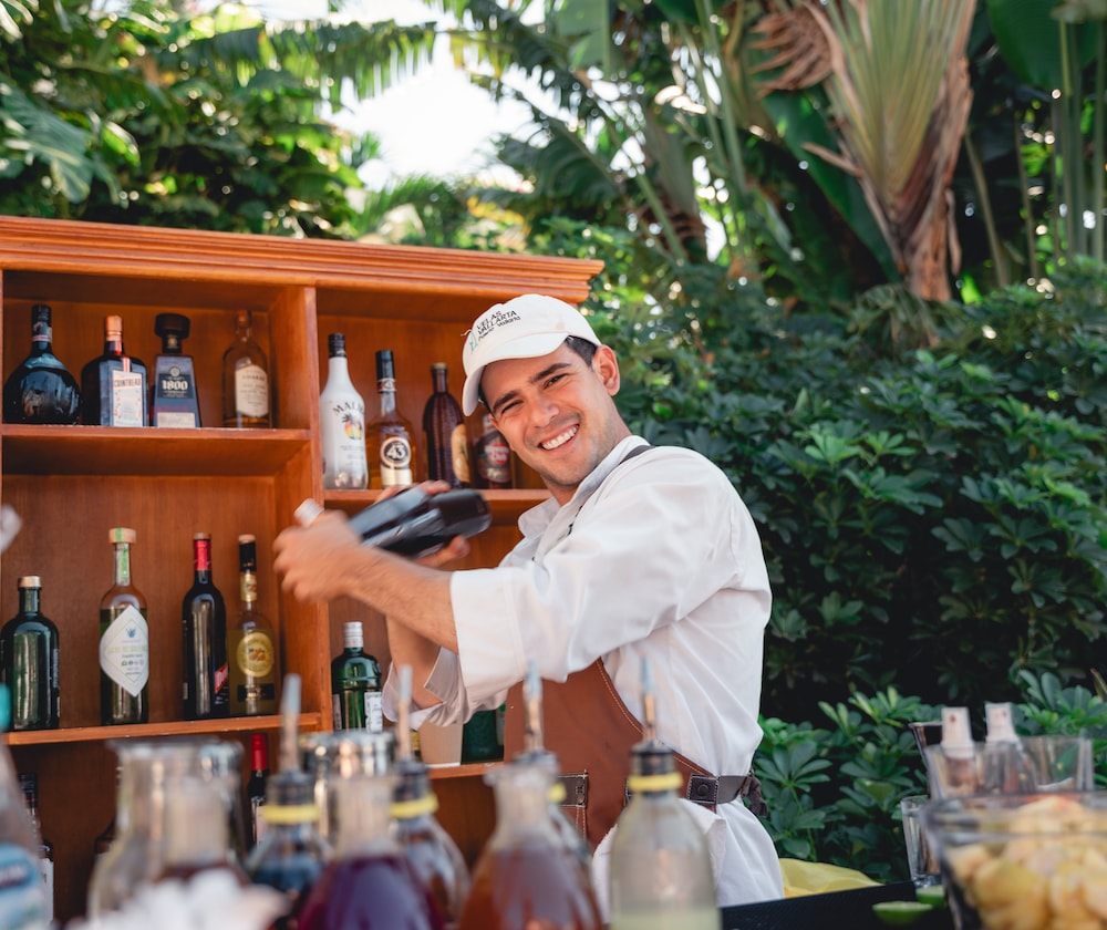 A man holding a bottle of alcohol