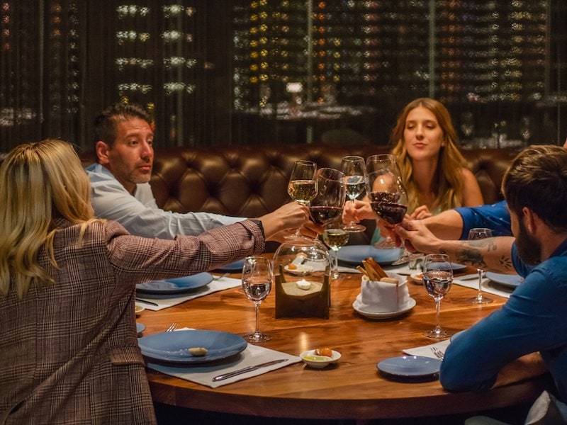Corporate toast during an exclusive private dinner.