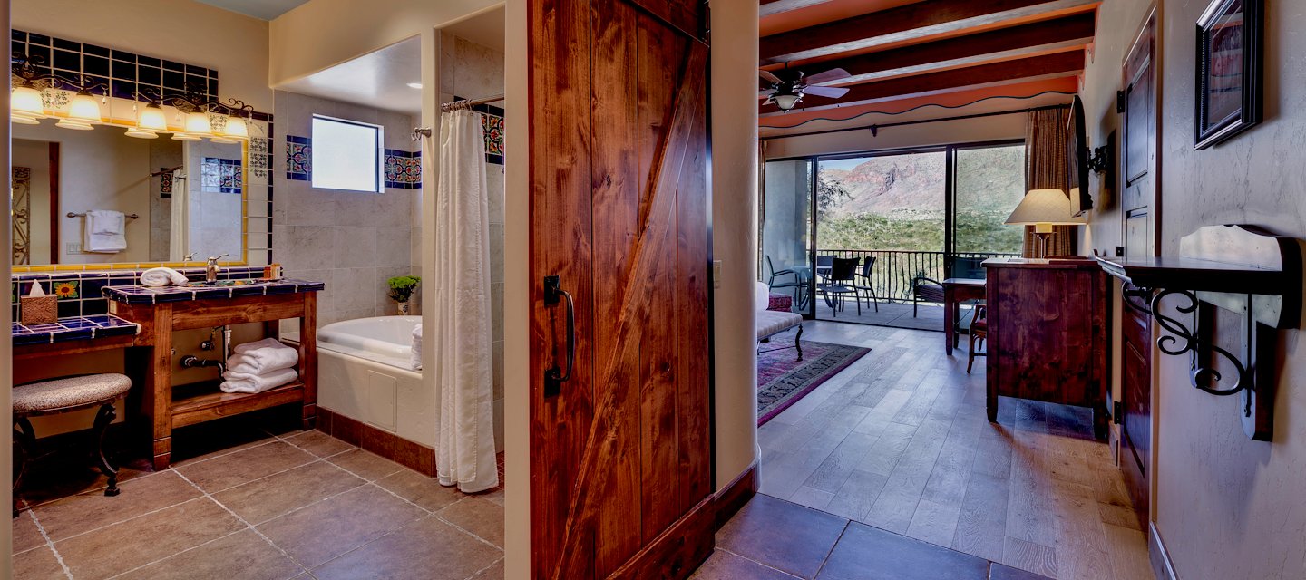 Bedroom with rustic wooden beams at Hacienda Del Sol Guest Ranch Resort, Tucson, Arizona