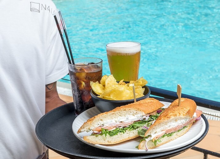 Outdoor pool with light meal or drink in Salema Beach Village