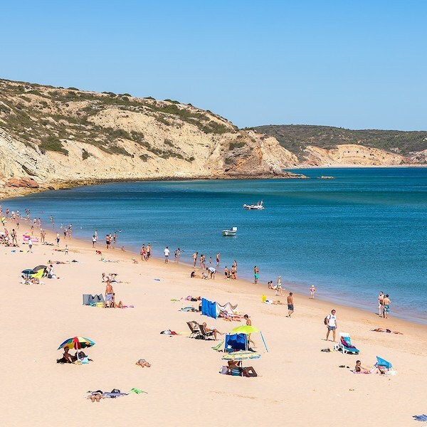 Take a sunbath at Praia Da Salema near Salema Beach Village,Portugal