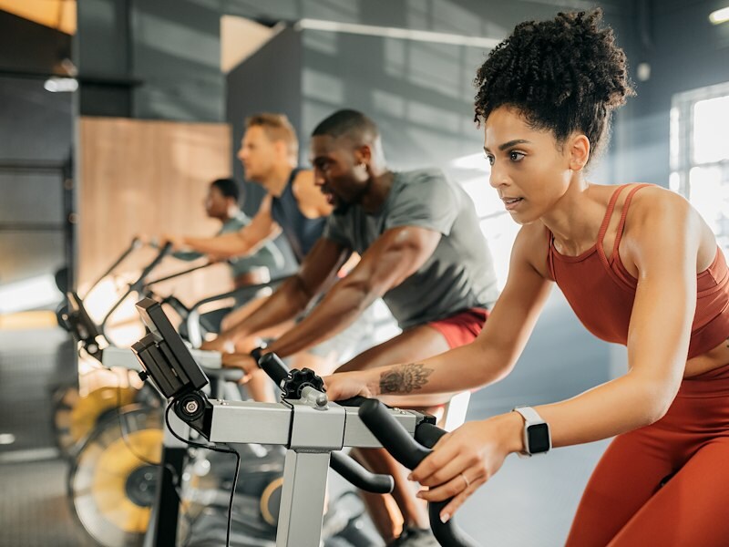 a group of people exercising on exercise bikes