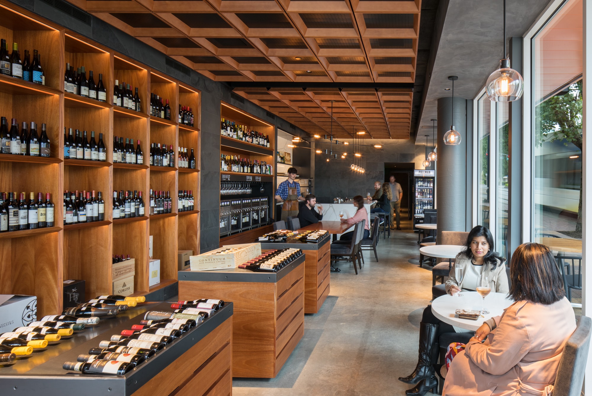 A wine merchant with people sitting at tables