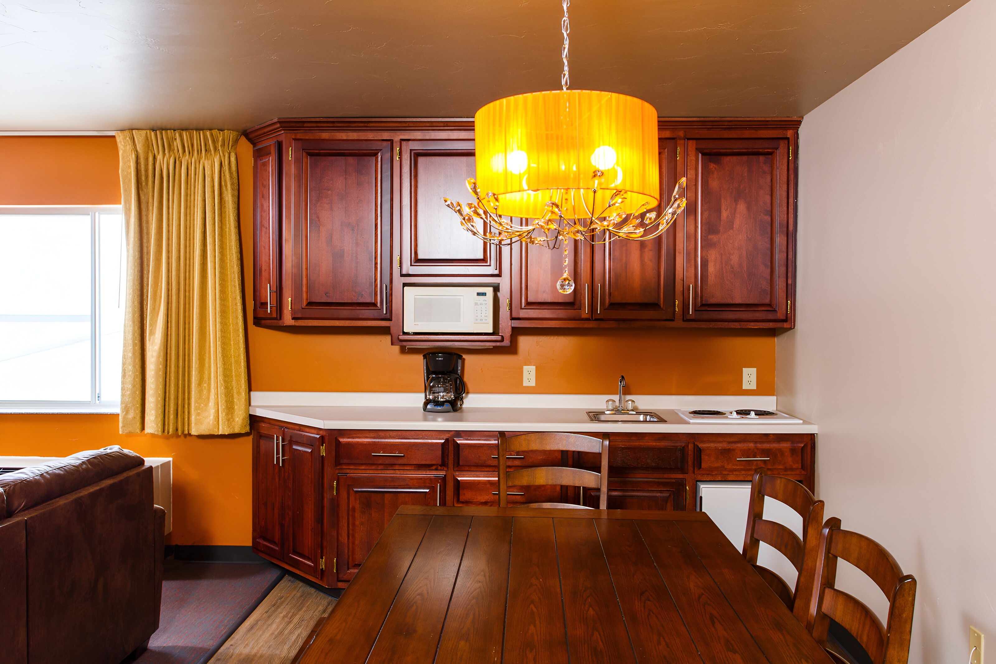 Hotel J Family Suite with king bed, modern decor, and window view, Green Bay, Wisconsin.