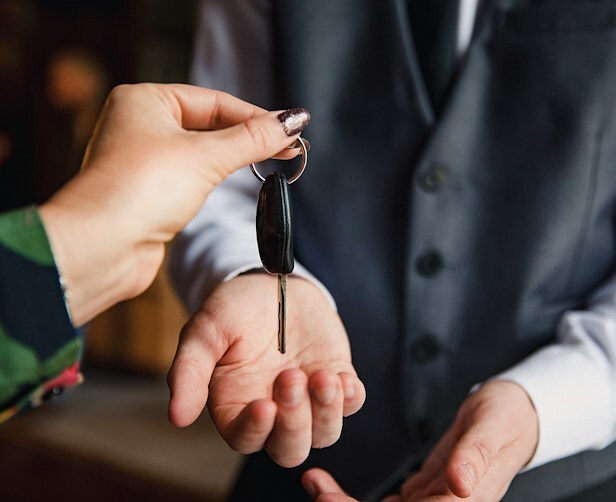 A guest checks in at Hotel Nikko San Francisco with a room key handoff