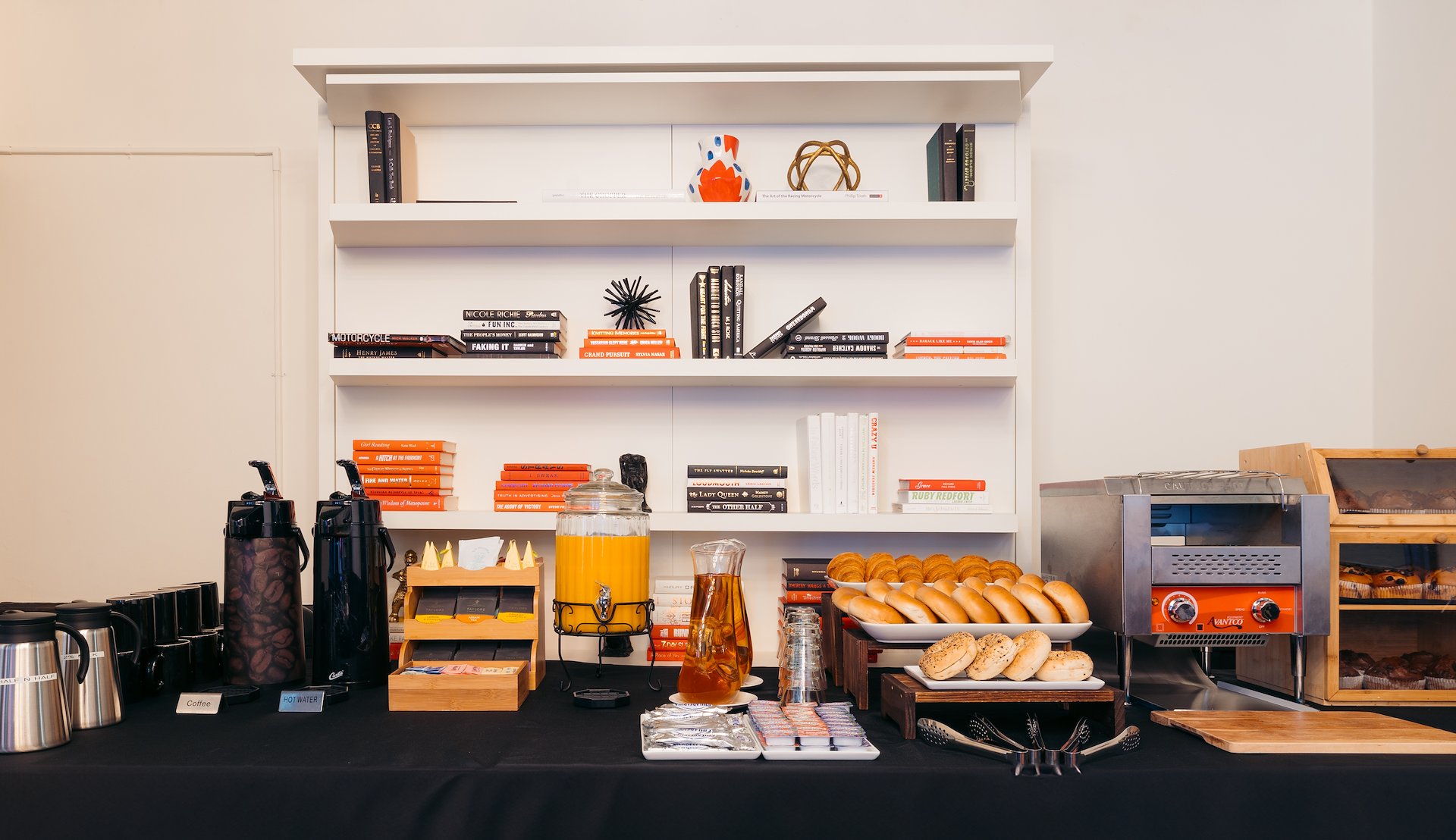 A breakfast buffet with food and drinks on a table