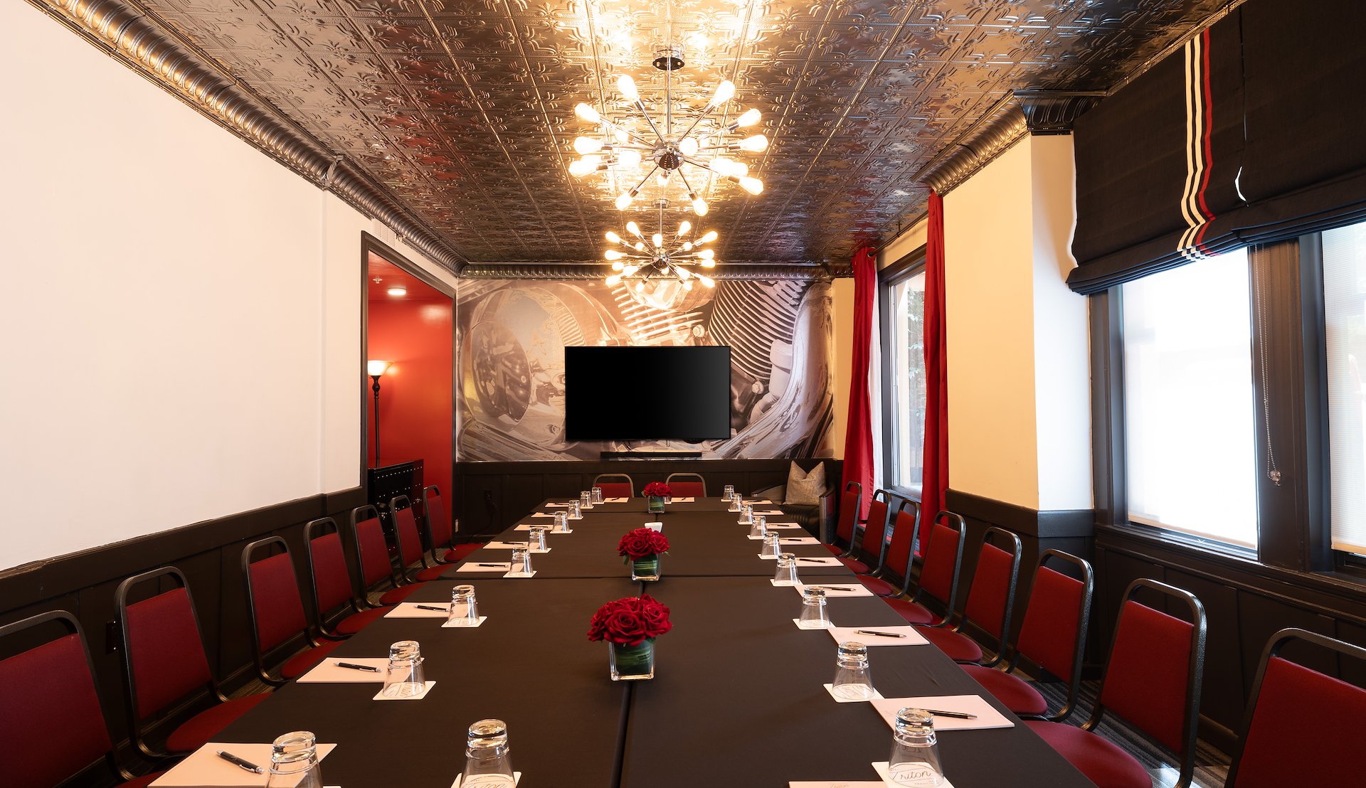 Meeting room at Hotel Triton with elegant decor and modern amenities.