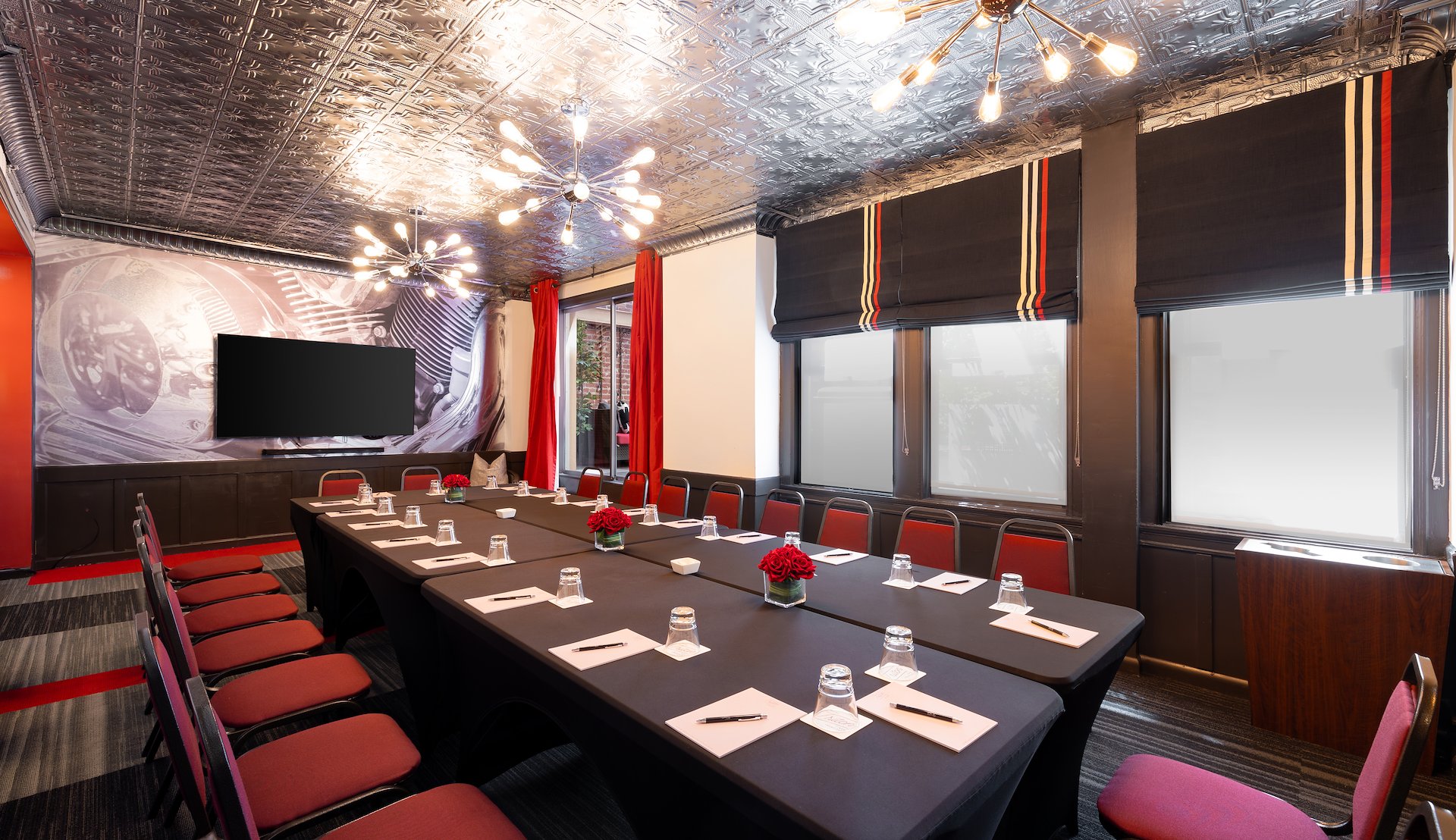 The meeting room at Hotel Triton features modern decor and seating.