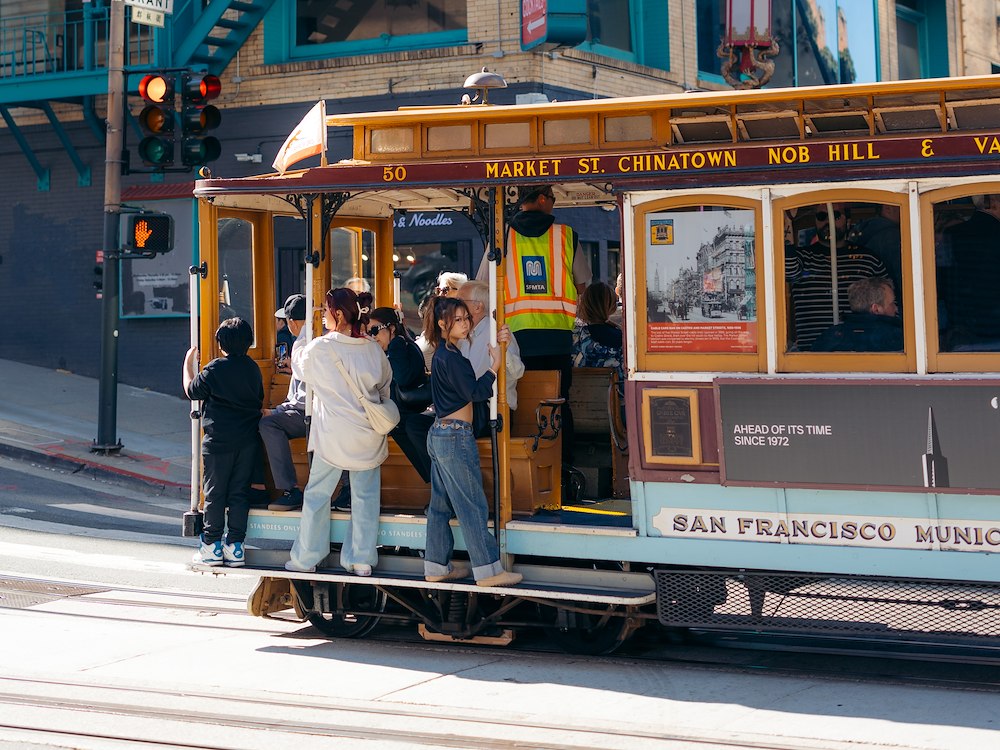 Historic cable car traveling through downtown, San Francisco