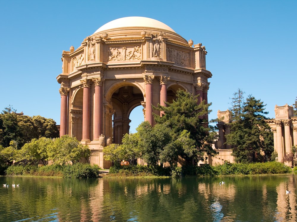 Palace of Fine Arts surrounded by trees and lagoon, San Francisco