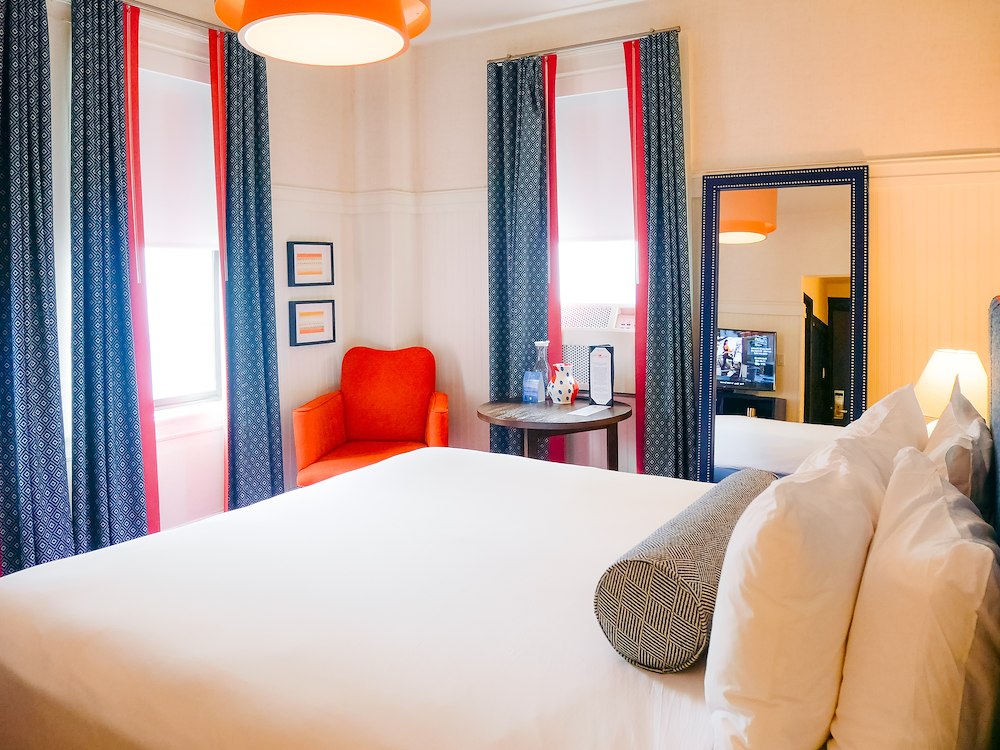 Spacious guest room with king bed and seating area at Hotel Triton Union Square San Francisco