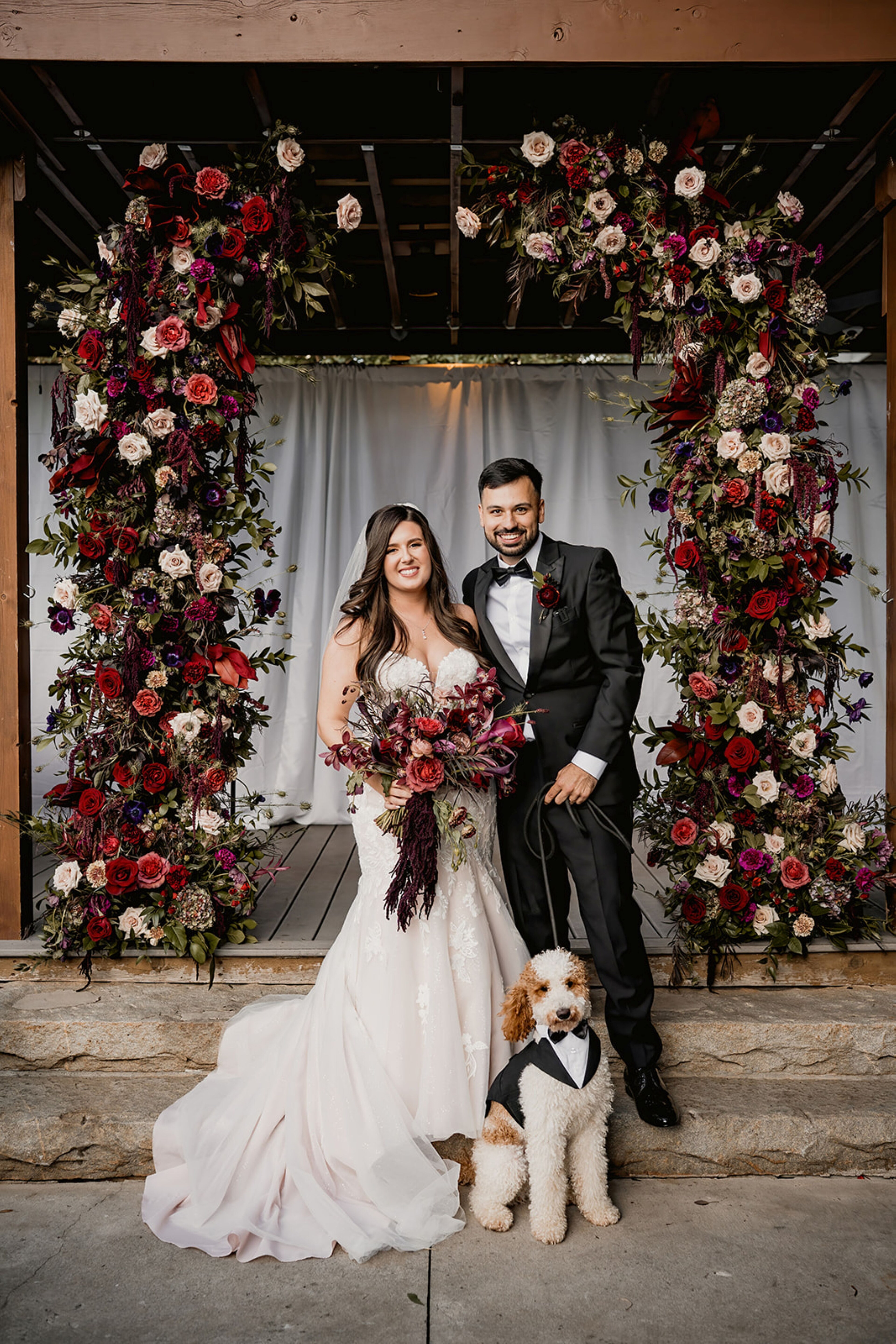 Couple and their dog on wedding day