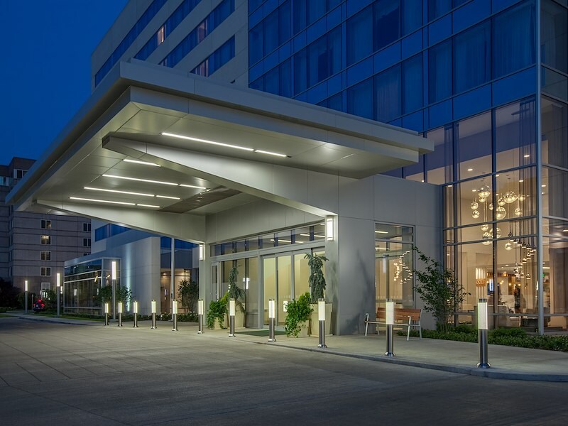 A building with a canopy and a street