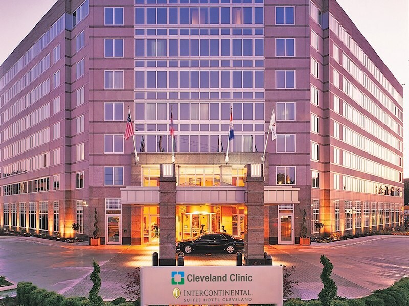 A large building with a sign in front of it