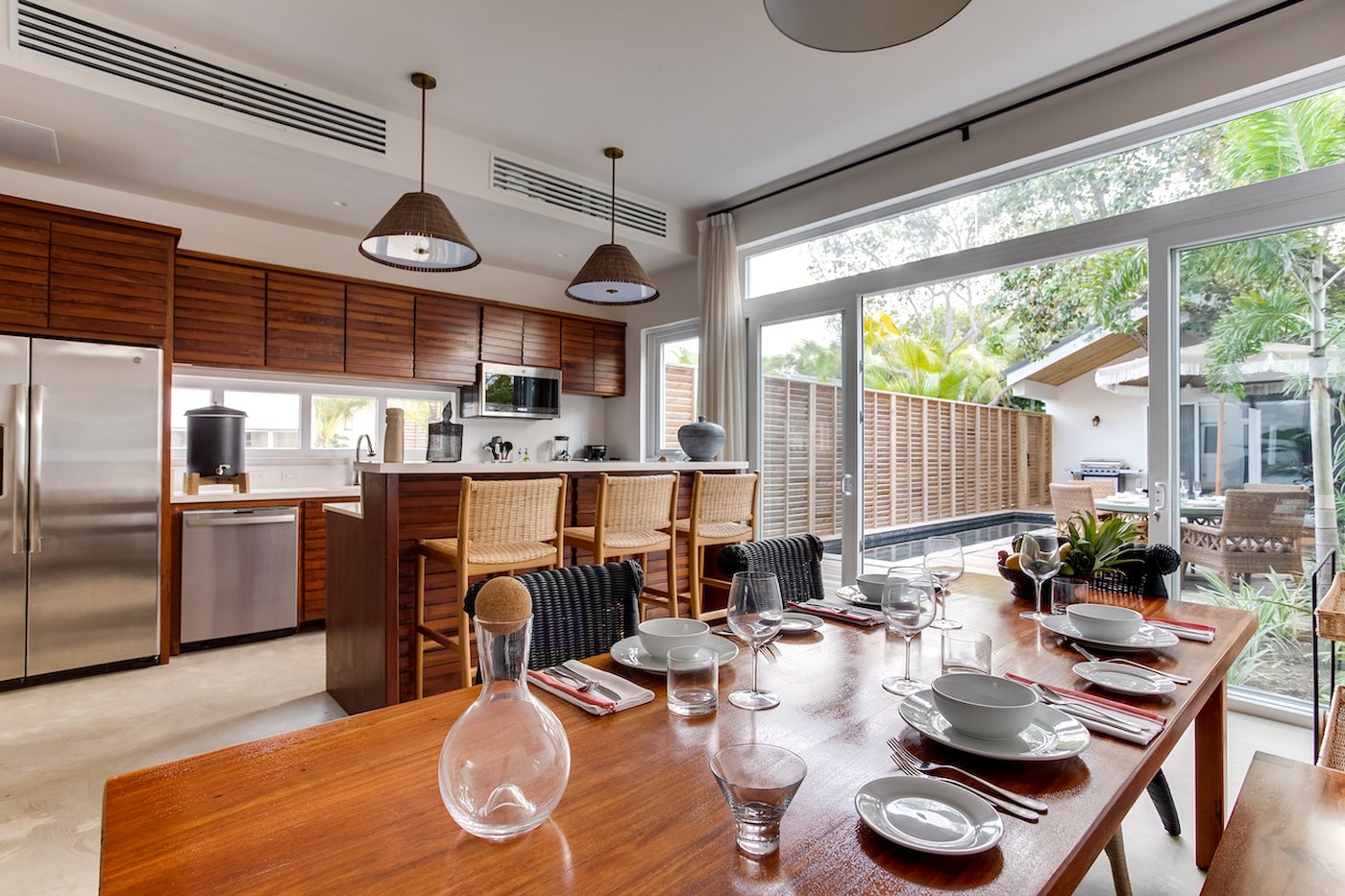 Open living and dining space inside the Two Bedroom Beach Villa at Itz'ana Resort, Belize