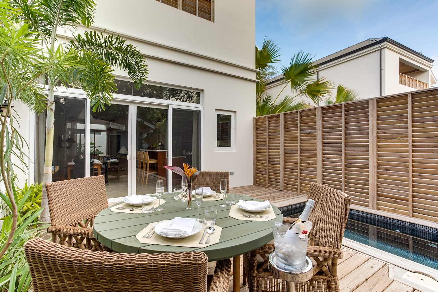 Outdoor dining on the beachfront deck of the Two Bedroom Beach Villa in Placencia, Belize