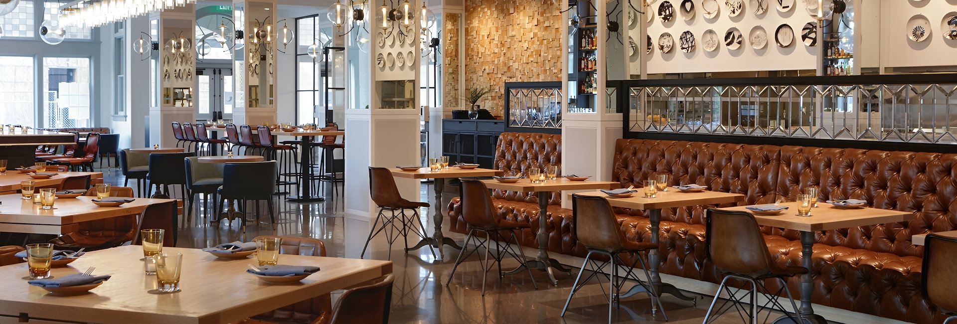 The interior features stylish seating and décor at Elm & Good Restaurant, Dallas, Texas.