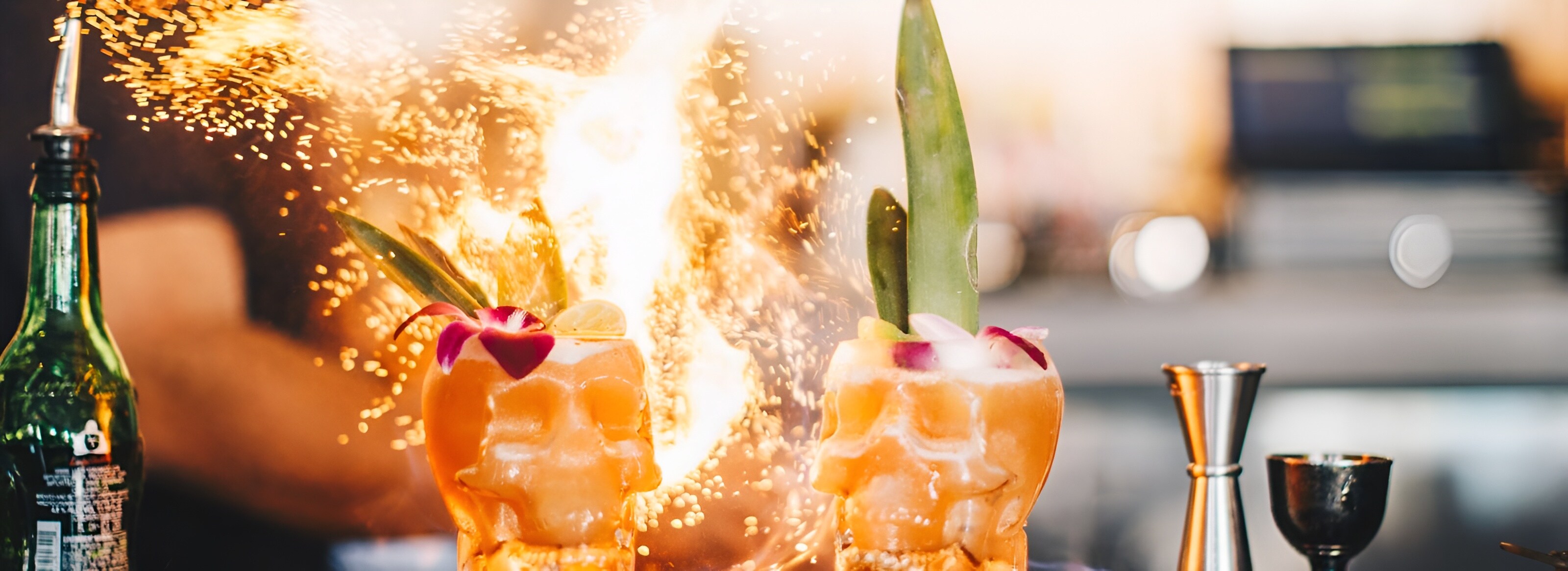 A bartender pours a flaming drink at Pacific Hideaway, Huntington Beach, CA.
